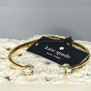 Kate Spade open cuff bracelet. 
Lady Marmalade in gold.